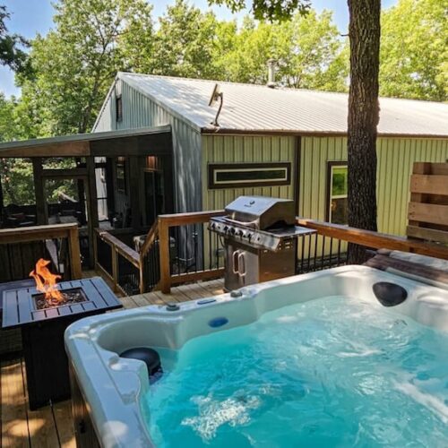Hot Tub in the Woods Vacation Rental Deck with Hot Tub at Hogscald Hollow Cabins