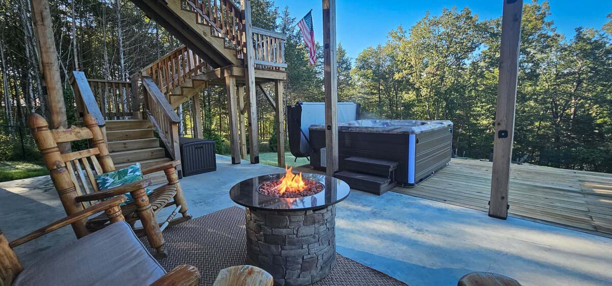 Loft at Lovers Leap Patio Seating & Hot Tub at Hogscald Hollow Cabins Vacation Rentals